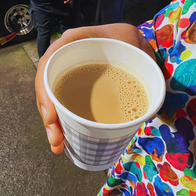 Steaming disposable cup of Masala Chai